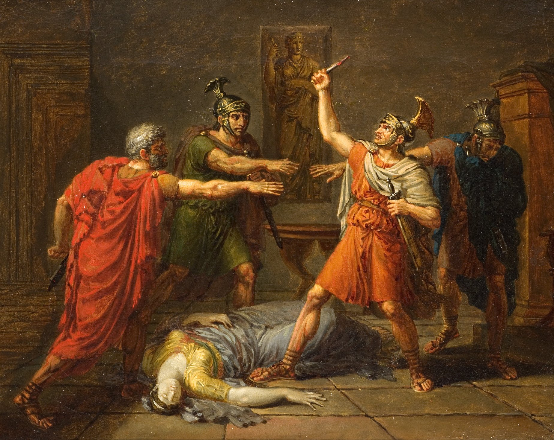 L'image représente une scène dramatique qui semble se dérouler dans un environnement ancien, probablement romain. Au centre, un personnage en armure, portant une tunique orange, est en train de brandir un glaive avec une expression déterminée. Il est entouré de plusieurs soldats romains qui semblent témoigner de la situation tendue. À leurs pieds, un corps inanimé, vraisemblablement celui d'une femme, gît sur le sol. En arrière-plan, une statue peut être aperçue, ajoutant une dimension historique à la scène. L'éclairage suggère une atmosphère sombre et tragique.