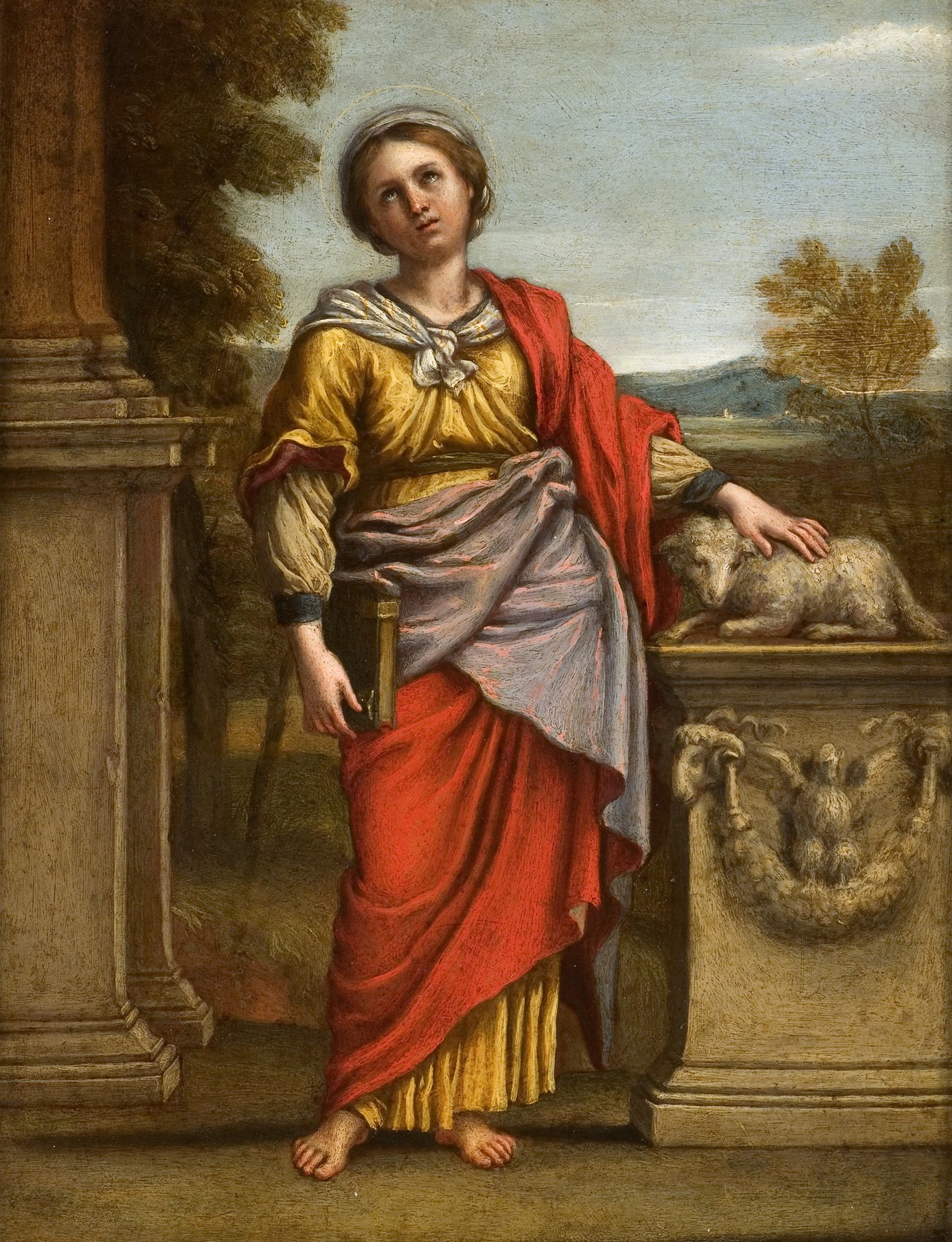 L'image représente une figure féminine debout, habillée d'une robe colorée avec des drapés minutieusement peints. Elle porte un voile sur la tête et a une expression sereine. À ses pieds se trouve un animal, probablement un mouton, placé sur un socle ou une pierre. La scène se déroule dans un paysage bucolique, avec des éléments architecturaux en arrière-plan, comme des colonnes, et des collines au loin. L'ensemble dégage une atmosphère paisible et religieuse.