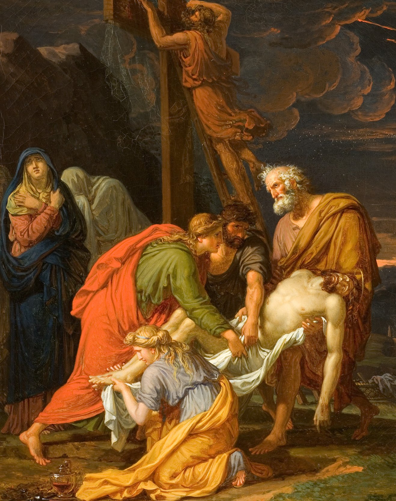 Cette image représente une scène biblique, probablement la descente de croix. On y voit plusieurs personnages autour d'un corps, vraisemblablement celui de Jésus, qui est en train d'être descendu de la croix. Les figures montrent une grande émotion, avec des gestes de tristesse et de compassion. À l'arrière-plan, on distingue des montagnes sombres et un ciel dramatique, ce qui accentue l'atmosphère tragique de la scène. Les vêtements des personnages, richement colorés, contrastent avec l'arrière-plan sombre, mettant en valeur le moment poignant qu'ils vivent.