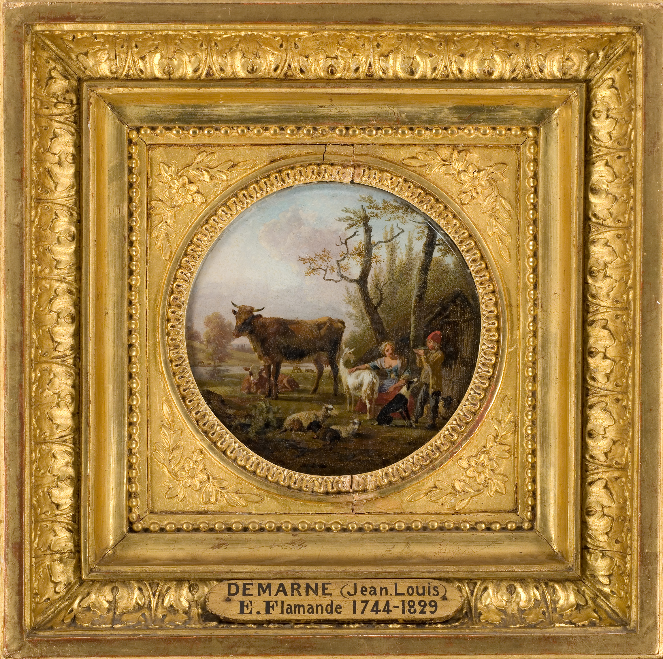 Cette image représente une peinture dans un cadre doré. Au centre, on observe une scène pastorale où une vache et un veau sont présents, entourés de quelques personnages, probablement des paysans. L'arrière-plan montre une nature verdoyante avec des arbres et un ciel clair, créant une ambiance paisible et bucolique. Le cadre ornémenté souligne la délicatesse de l'œuvre, qui est signée par l'artiste Jean-Louis Demarne, connu pour ses paysages et scènes de la vie rurale.