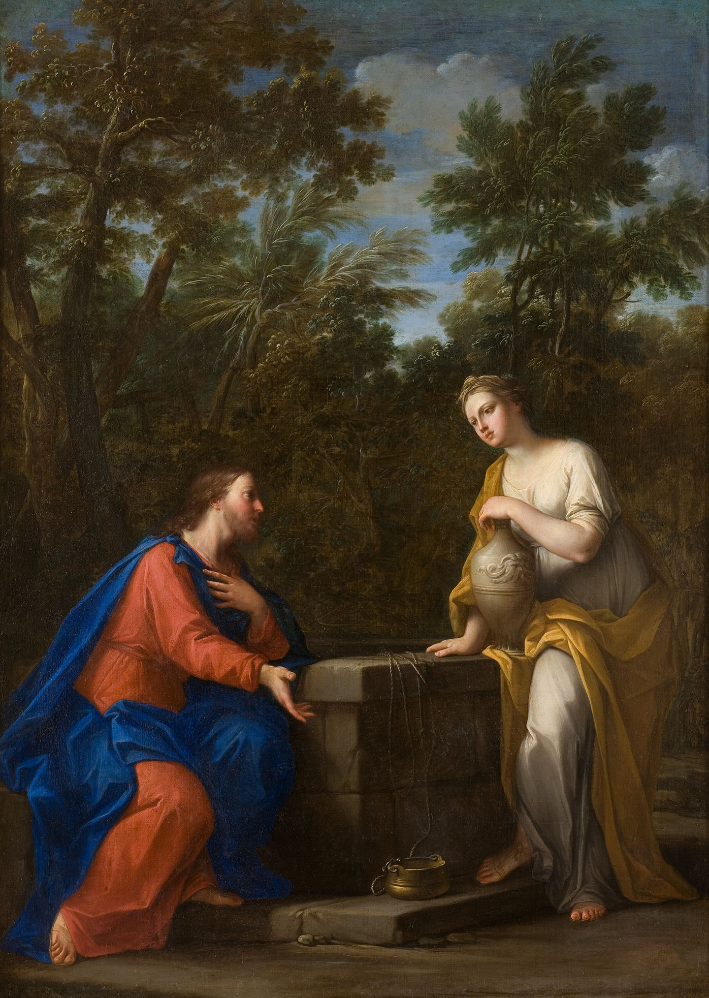 Cette image représente une scène biblique célèbre, souvent associée à la rencontre entre Jésus et la Samaritaine au puits. Dans le tableau, Jésus, vêtu d'une tunique rouge et d'un manteau bleu, est assis près d'un puits. Il regarde une femme qui se tient devant lui, vêtue d'une robe jaune et tenant un vase. L'arrière-plan est verdoyant, avec des arbres et un ciel bleu, créant une atmosphère paisible. La scène évoque un moment de dialogue et de révélation, mettant en avant des thèmes de rencontre et de partage.