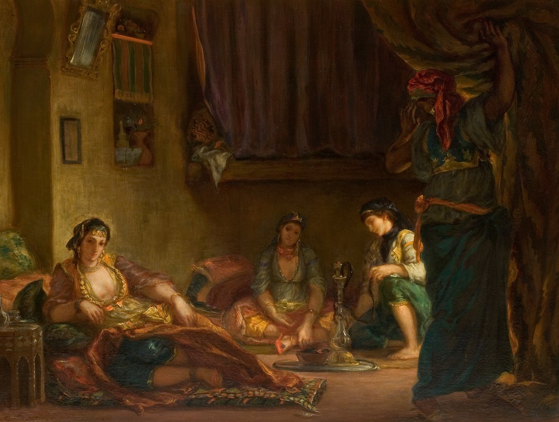 L'image représente une scène intérieure, probablement inspirée par des thèmes orientaux. On voit trois femmes, habillées avec des vêtements richement colorés et ornés, qui semblent se détendre dans un espace intime. L'une d'elles est allongée sur des coussins, tandis que les deux autres sont assises, l'une d'elles tenant un accessoire ou un outil près d'un brûleur. L'éclairage de la pièce est doux, créant une ambiance chaleureuse et confortable, accentuée par des drapés et des détails décoratifs sur les murs. La composition évoque un sentiment de sérénité et de convivialité.