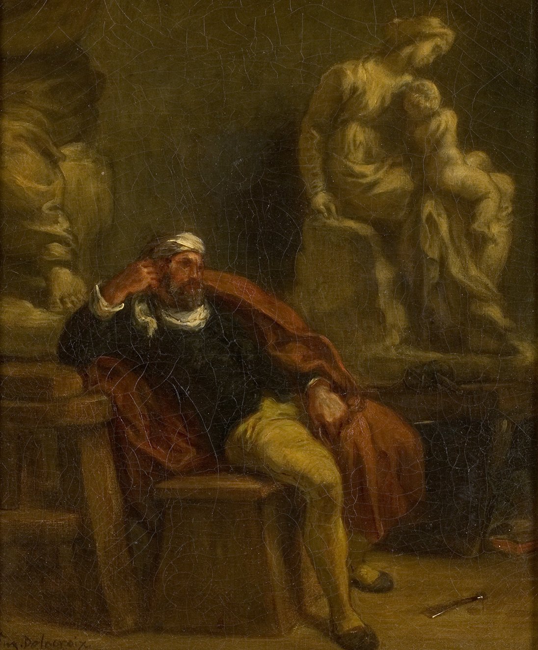 L'image montre un homme assis sur une chaise, visiblement pensif et pensant à quelque chose de profond. Il porte une tenue sombre, avec une écharpe ou un bandage autour de la tête. À l'arrière-plan, on peut voir une statue représentant une femme avec un enfant, ajoutant une atmosphère réfléchie à la scène. Les couleurs sont plutôt sombres, créant une ambiance d'introspection et de mélancolie. L'éclairage semble diriger l'attention vers l'homme, mettant en avant son expression contemplative.