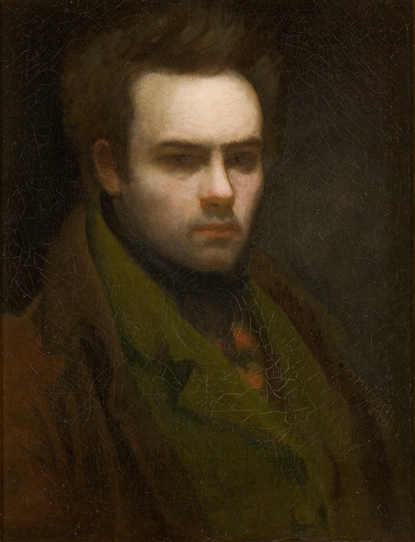 L'image représente un portrait d'un jeune homme, probablement un autoportrait. Il a un regard intense et sérieux, avec des cheveux en désordre et une expression pensive. Il porte un manteau de couleur sombre et une cravate colorée, ce qui ajoute du contraste à son apparence. Le fond est sombre, ce qui met en valeur son visage et ses traits. La texture de la peinture semble légèrement craquelée, ce qui donne un aspect ancien à l'œuvre.