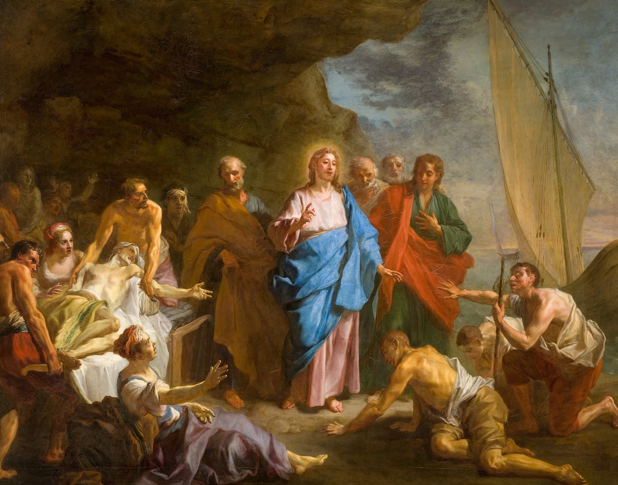 L'image représente une scène religieuse, probablement d'une œuvre artistique classique mettant en avant un moment biblique. Au centre, on voit une figure centrale, souvent identifiée comme Jésus, vêtu d'une tunique bleue et de vêtements clairs. Il semble s'adresser à un groupe de personnes, dont certaines sont allongées, et d'autres, de différents âges, se tiennent debout ou à genoux, exprimant des émotions variées. À l'arrière-plan, un paysage ensoleillé est visible, avec une grande voile blanche suggérant une activité maritime. L'ensemble évoque une atmosphère de miracle ou d'intervention divine, typique des représentations religieuses.