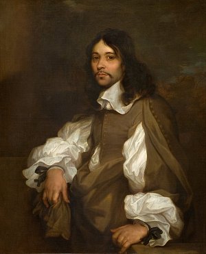 Cette image représente un portrait d'un homme au visage doux et à l'allure élégante. Il est vêtu d'une tunique de couleur sombre et porte des manches blanches volumineuses, typiques de la mode du XVIIe siècle. Ses cheveux sont longs et bouclés, retombant sur ses épaules. L'homme semble confiant, assis de manière décontractée, avec une posture qui dégage une certaine noblesse. L'arrière-plan est flou, ce qui met l'accent sur son visage et sa tenue. L'éclairage est doux, ajoutant une atmosphère chaleureuse au tableau.